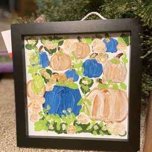 Pumpkin and flowers on hanging sign